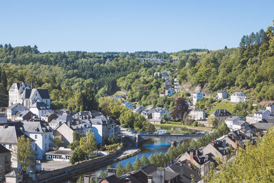 High angle view of river amidst trees against clear sky