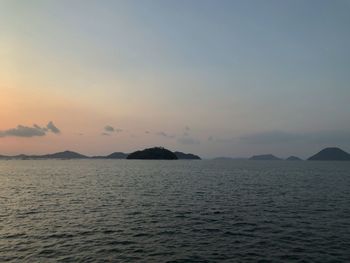 Scenic view of sea against clear sky during sunset