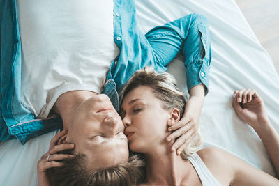 Young couple lying on bed