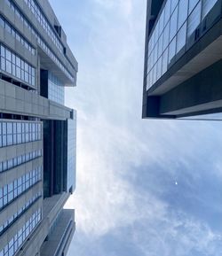 Low angle view of modern buildings against sky