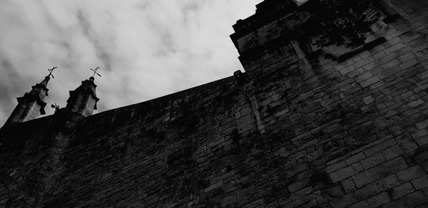 Low angle view of old building against sky