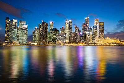 Illuminated modern buildings in city at night