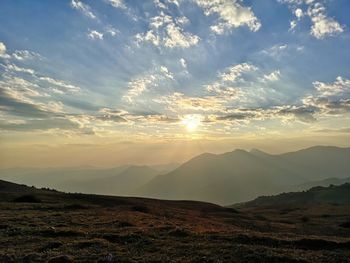 Scenic view of landscape against sky during sunset