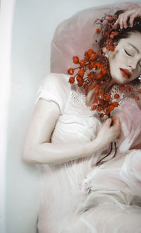 Close-up of woman holding flower bouquet