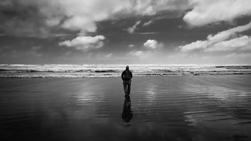 Scenic view of sea against cloudy sky