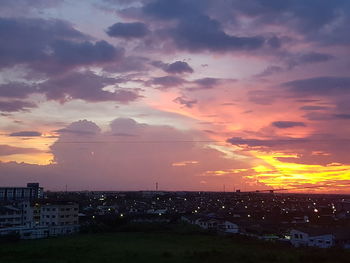 High angle view of buildings against sky at sunset