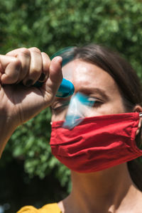 Using hand held ventilator to cool down a virus protective face mask