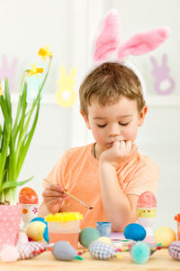 Portrait of cute girl playing with toys on table