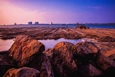 Scenic view of sea against sky at sunset