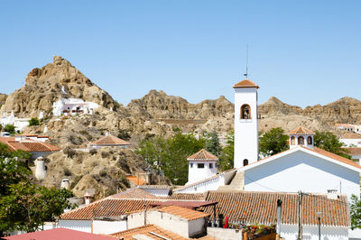 Houses against clear sky in city