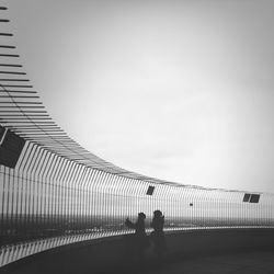 Silhouette of woman against sky