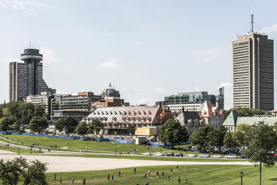 Buildings in city against sky