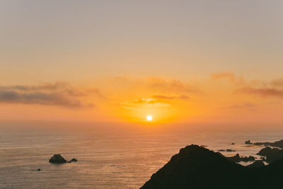 Misty sunset over cliffs of pacific ocean in baja, mexico.