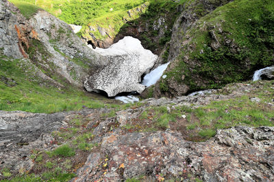 White image of water flowing through rocks