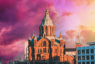 Low angle view of cathedral against cloudy sky