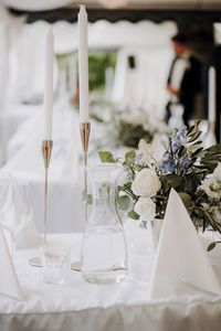 Close-up of white wedding decoration on table