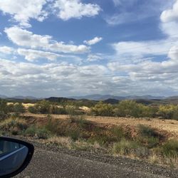 Scenic view of landscape against cloudy sky