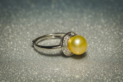 Close-up of wedding rings on table