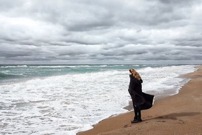 Woman standing on beach