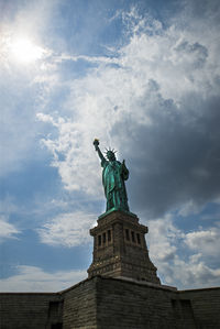 Low angle view of statue against cloudy sky