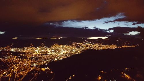 Aerial view of illuminated cityscape at night