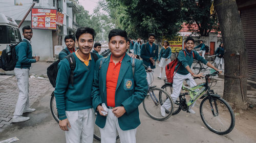 Portrait of people on bicycle in city