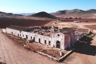 Buildings against mountain range