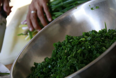 Close-up of person preparing food in kitchen