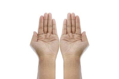 Close-up of human hand against white background