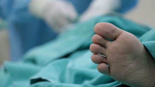 Close-up of hands holding baby hand