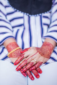 Close-up of woman hand with text