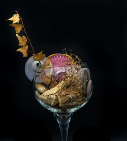 Close-up of wine glass against black background