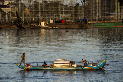 People on boat sailing in river