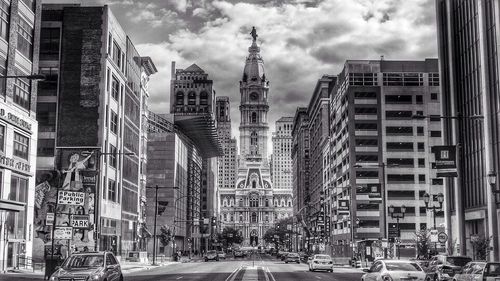 City street against cloudy sky