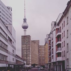 View of communications tower in city