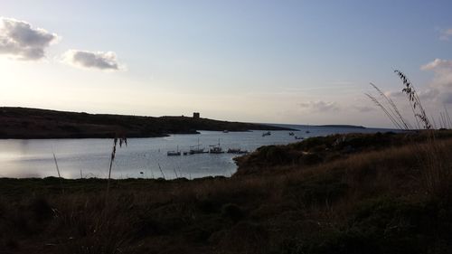 Scenic view of landscape against cloudy sky