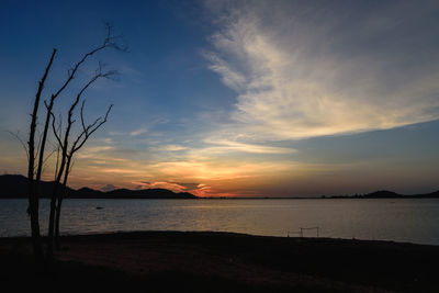 Reservoir with surrounding mountains and beautiful skies in thailand.