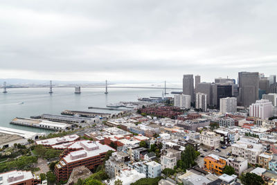 High angle view of buildings in city against sky