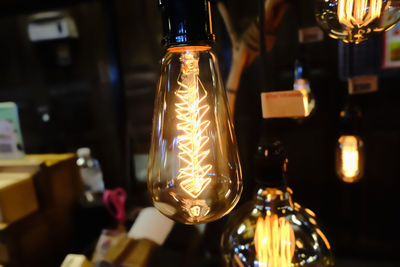 Close-up of illuminated light bulb