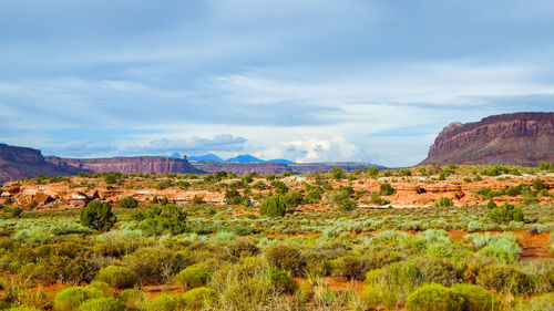 Scenic view of mountains against cloudy sky