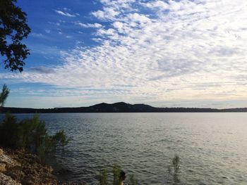 Scenic view of sea against cloudy sky