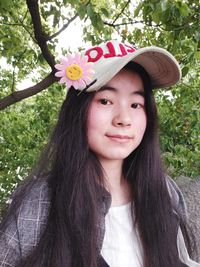 Portrait of smiling woman wearing cap