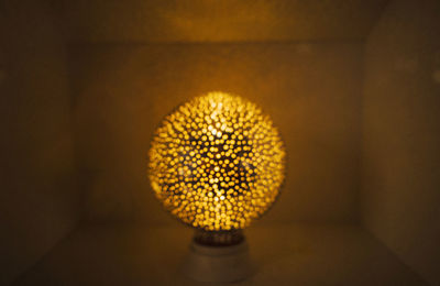 Close-up of illuminated light bulb