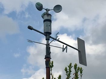 Low angle view of street light against sky