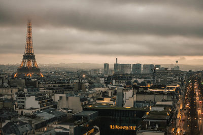 High angle view of buildings against cloudy sky