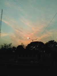 Silhouette of trees against sky at sunset