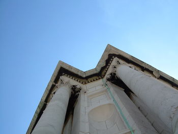 Low angle view of built structure against clear blue sky