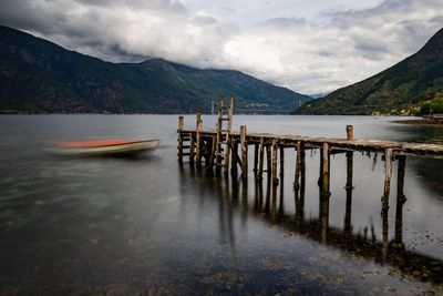 Pier over lake against sky