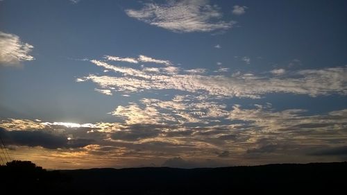 Silhouette of landscape against sky