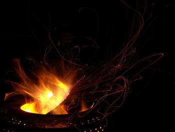 Close-up of illuminated fire at night